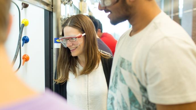 Chemistry professor Christina Cooley teaches students in the lab.