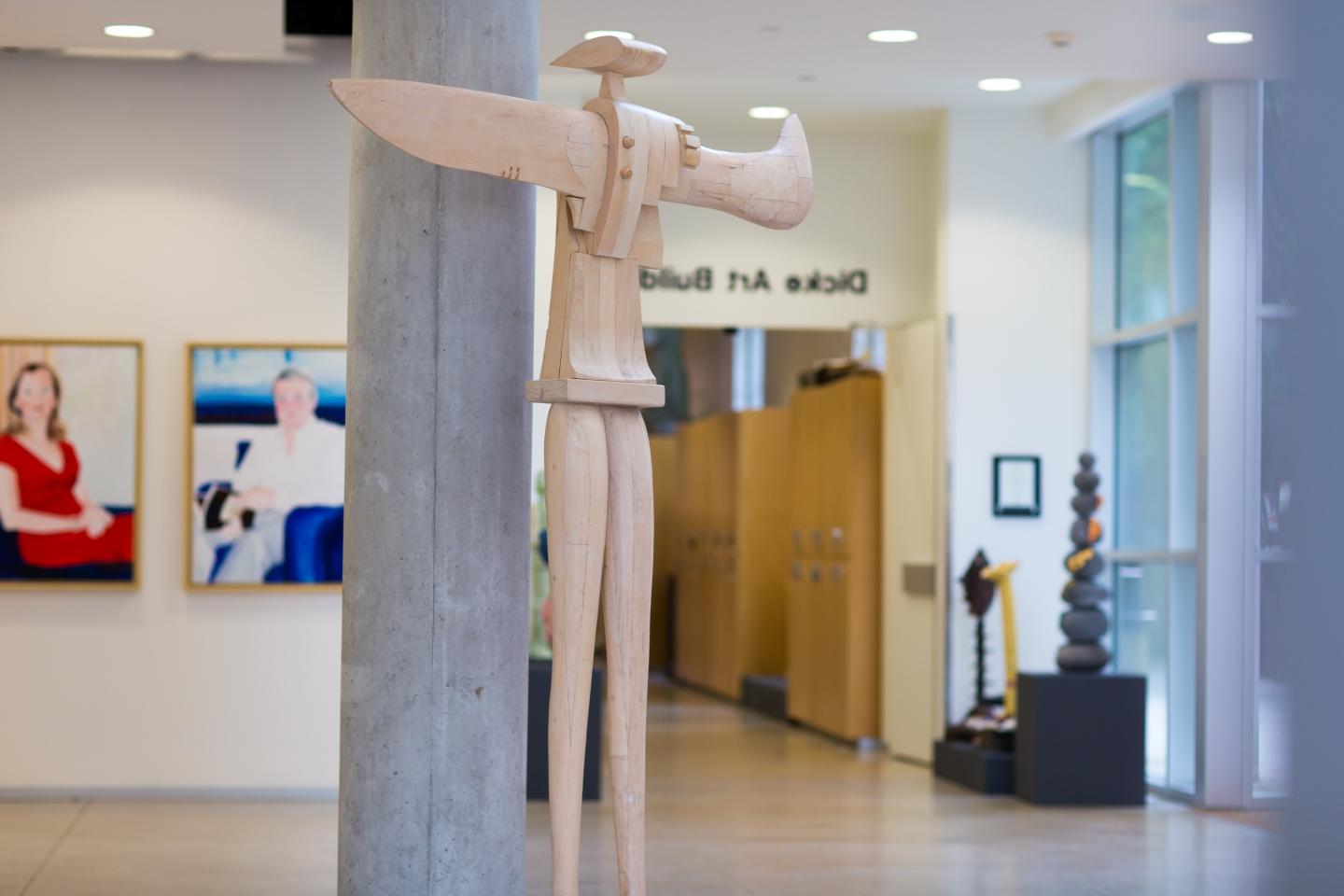 Wooden sculpture from the Everette art installation inside the Dicke art building